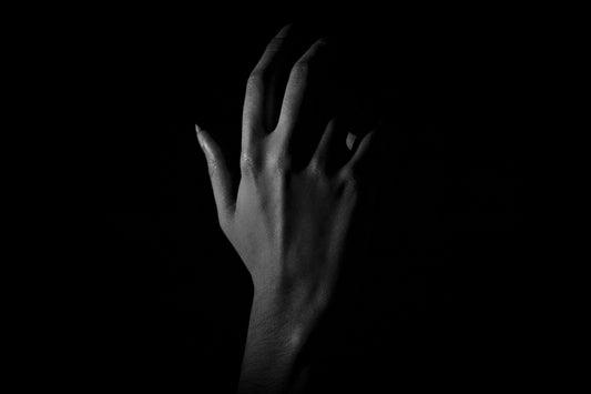 grayscale photo of persons hand